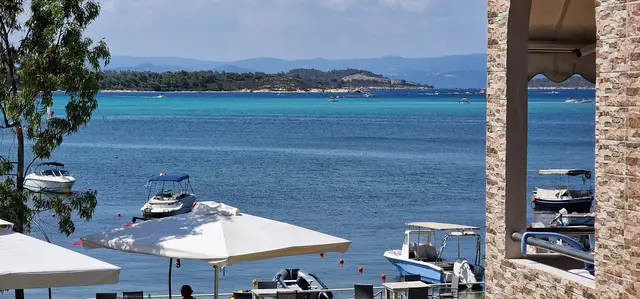 Panorama of the turquoise bay framed from the terrace